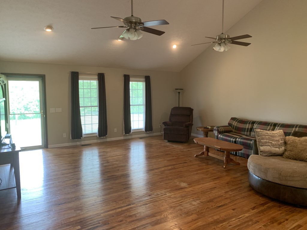 579 Rocky Road Liberty, TN 37095 - Photo 27 of 44 a living room with furniture and a wooden floor