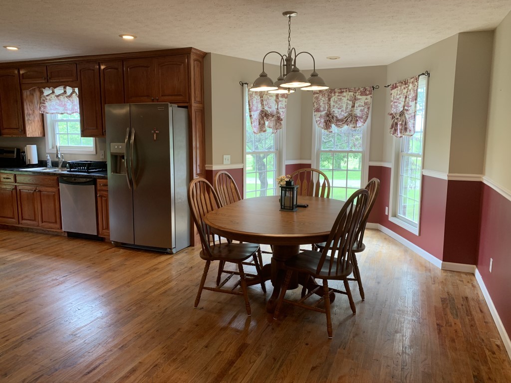 579 Rocky Road Liberty, TN 37095 - Photo 30 of 44 a view of a dining room with furniture window and wooden floor