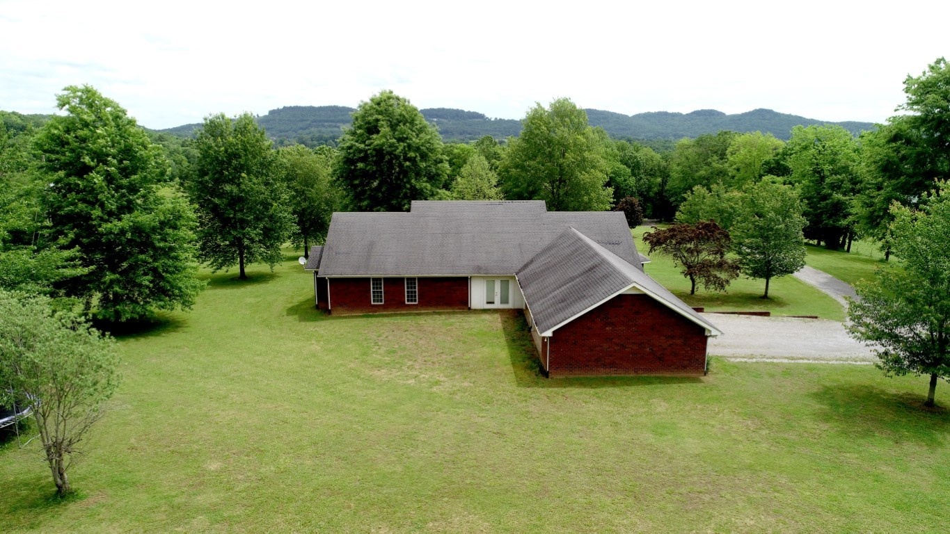 579 Rocky Road Liberty, TN 37095 - Photo 4 of 44 an aerial view of a house with table and chairs