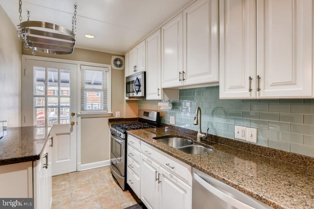 1605 Hardwick Road Towson, MD 21286 - Photo 10 of 32 Granite countertops in the bright kitchen
