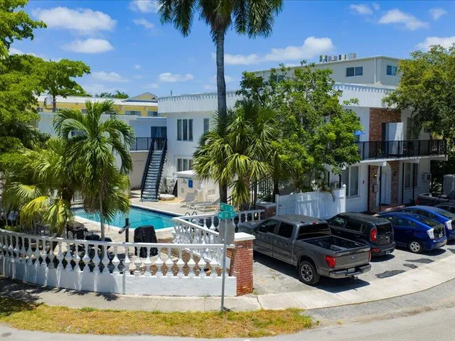 a swimming pool with outdoor seating and yard