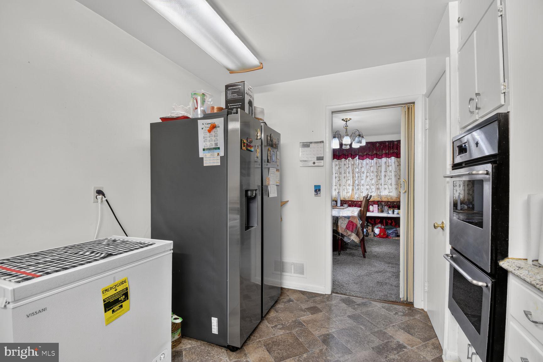 1207 Oakview Drive Silver Spring, MD 20903 - Photo 6 of 25 Cozy kitchen with modern appliances.
