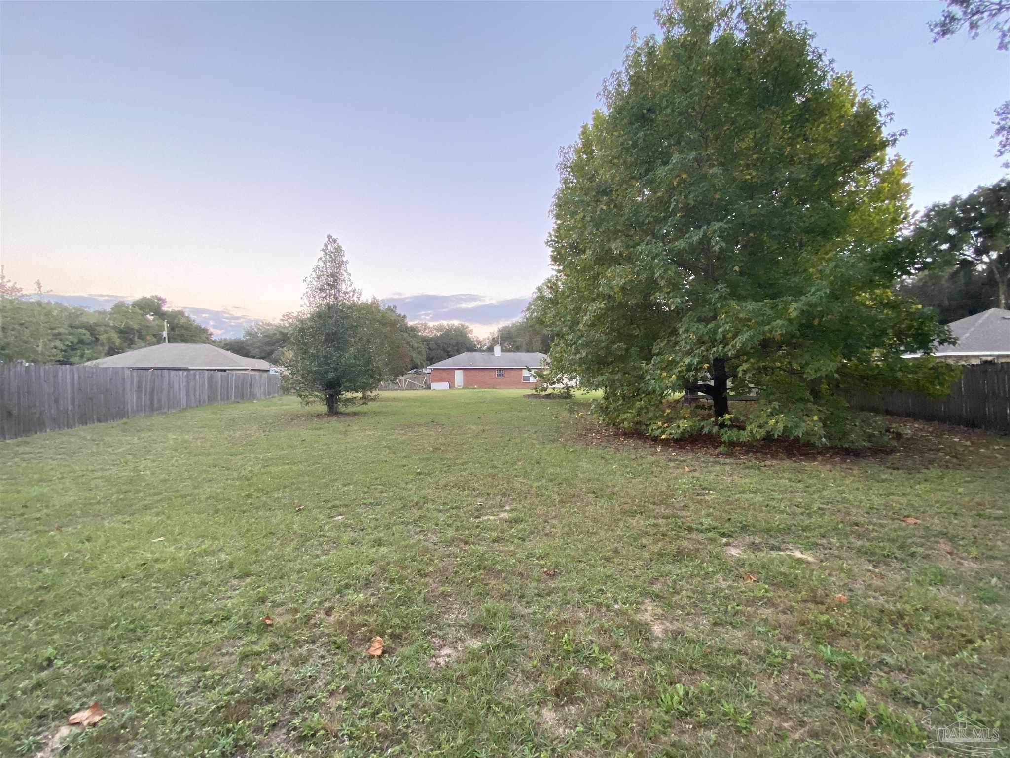5493 Riviera Drive Milton, FL 32583 - Photo 20 of 21 a view of an outdoor space and yard