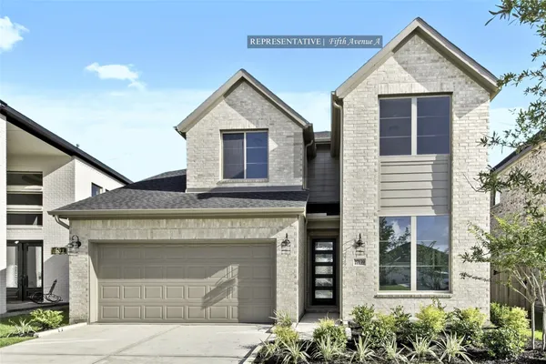 a front view of a house with a garage