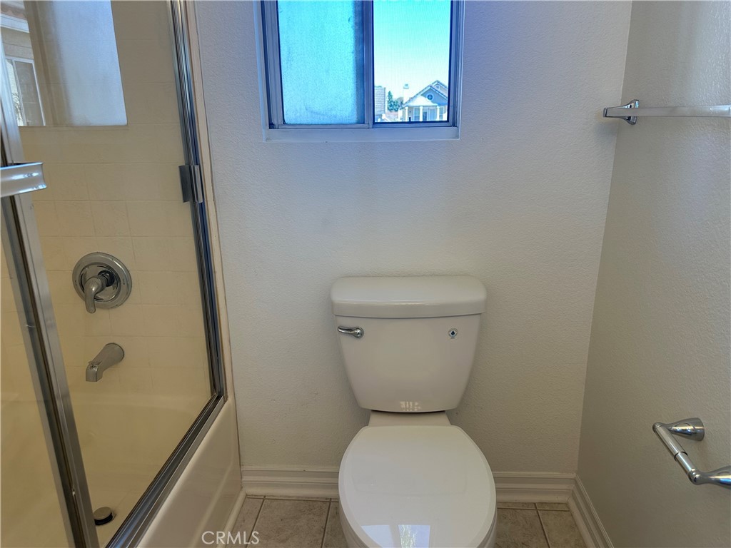 201 Laurel Avenue, Unit 6 Brea, CA 92821 - Photo 19 of 24 a bathroom with a toilet and a shower