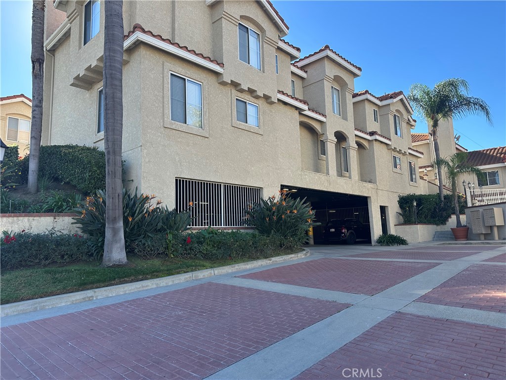 201 Laurel Avenue, Unit 6 Brea, CA 92821 - Photo 24 of 24 a front view of a residential apartment building with a yard