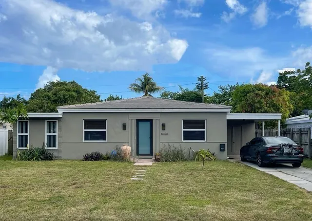 a kitchen with cabinets a sink and a microwave