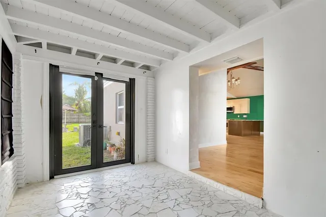 a view of a living room and dining room