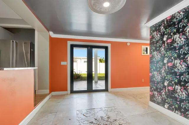 a hallway with paintings on the wall