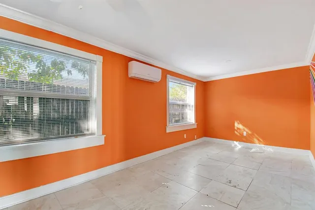 a view of a porch with chairs and backyard