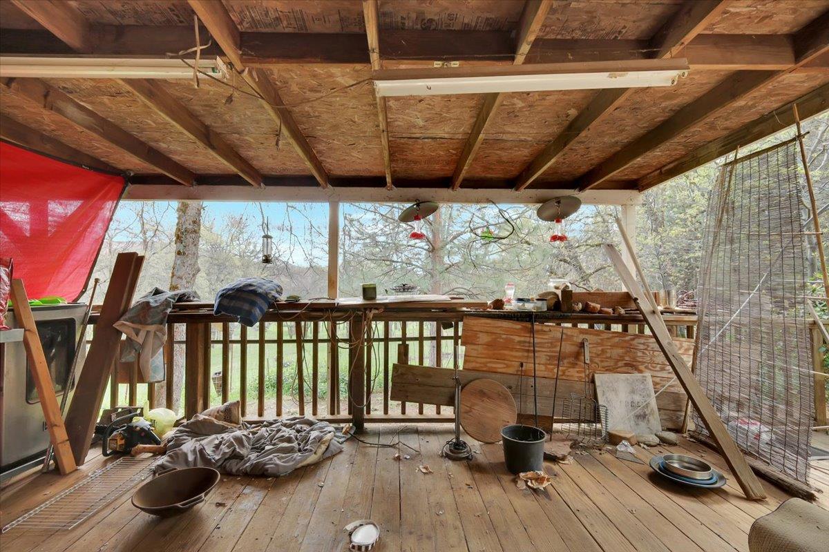 10447 Texas Hill Road Dobbins, CA 95935 - Photo 12 of 55 a view of a balcony with chairs and wooden floor