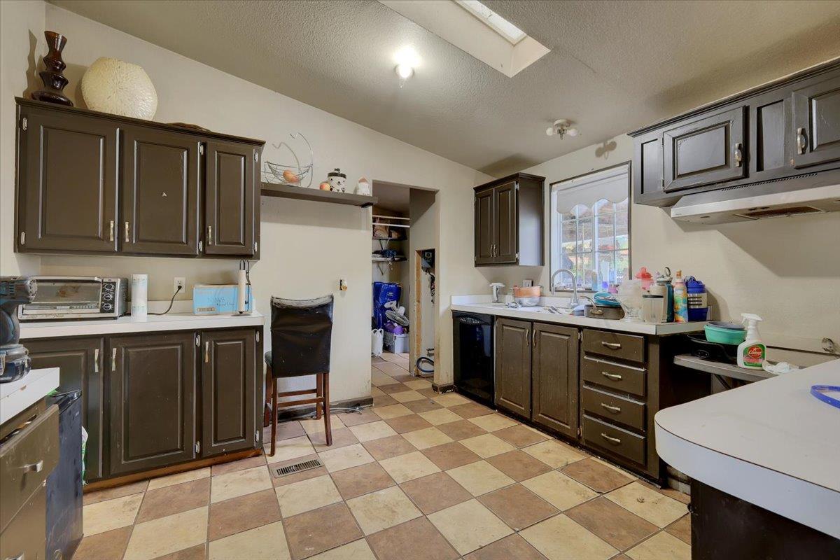 10447 Texas Hill Road Dobbins, CA 95935 - Photo 15 of 55 a kitchen with a sink stove and cabinets