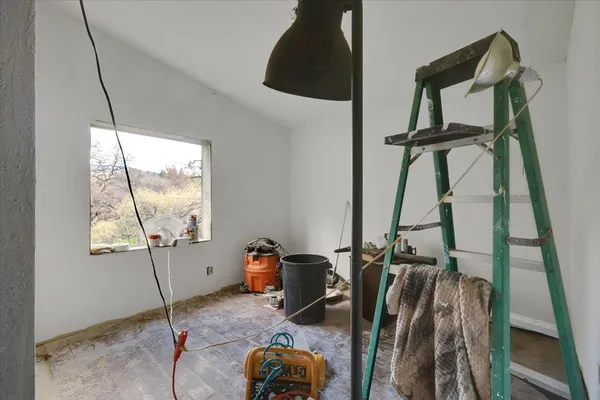 a bathroom with a sink vanity mirror and toilet