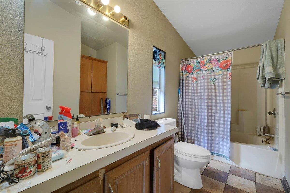 10447 Texas Hill Road Dobbins, CA 95935 - Photo 25 of 55 a bathroom with a sink vanity mirror and toilet