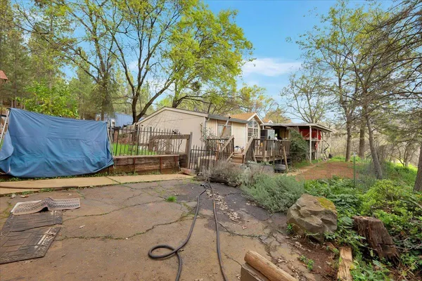 a view of a house with a yard covered in snow