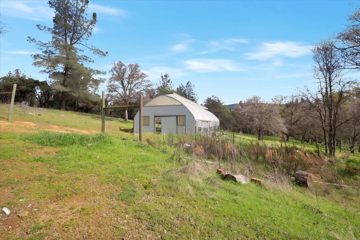 10447 Texas Hill Road Dobbins, CA 95935 - Photo 34 of 55 a view of a house with a yard