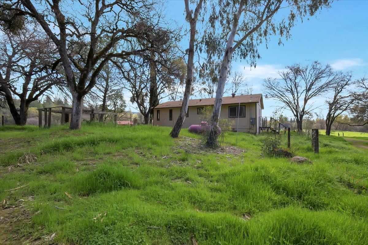 10447 Texas Hill Road Dobbins, CA 95935 - Photo 39 of 55 a view of a house with a backyard