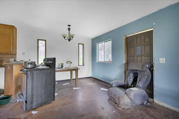 a room with furniture and a flat screen tv