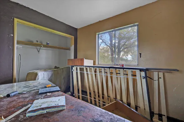 a living room with gym equipment and a window