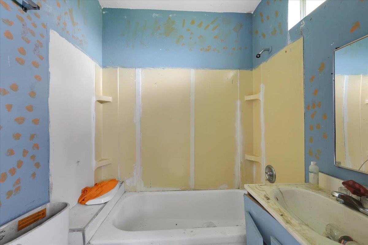 10447 Texas Hill Road Dobbins, CA 95935 - Photo 53 of 55 a bathroom with a tub sink and mirror