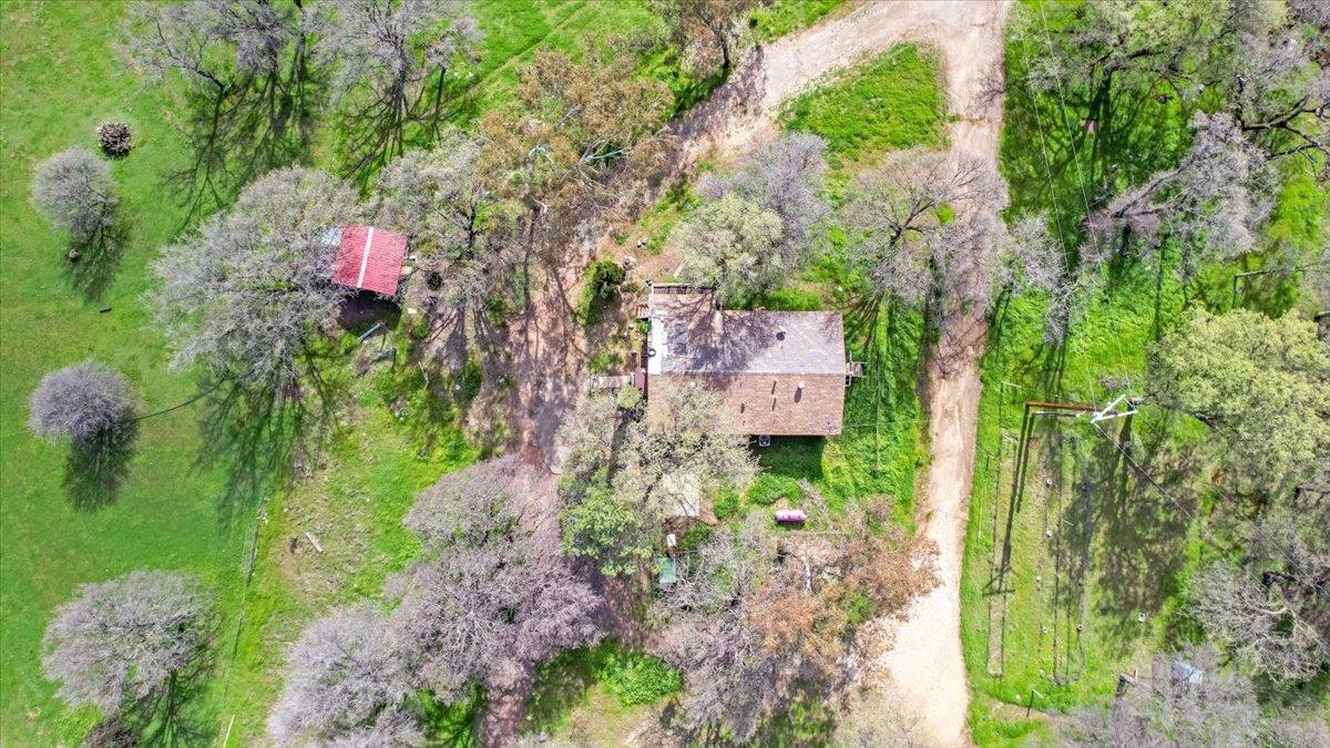 10447 Texas Hill Road Dobbins, CA 95935 - Photo 9 of 55 a backyard of a house with a yard fountain and outdoor seating