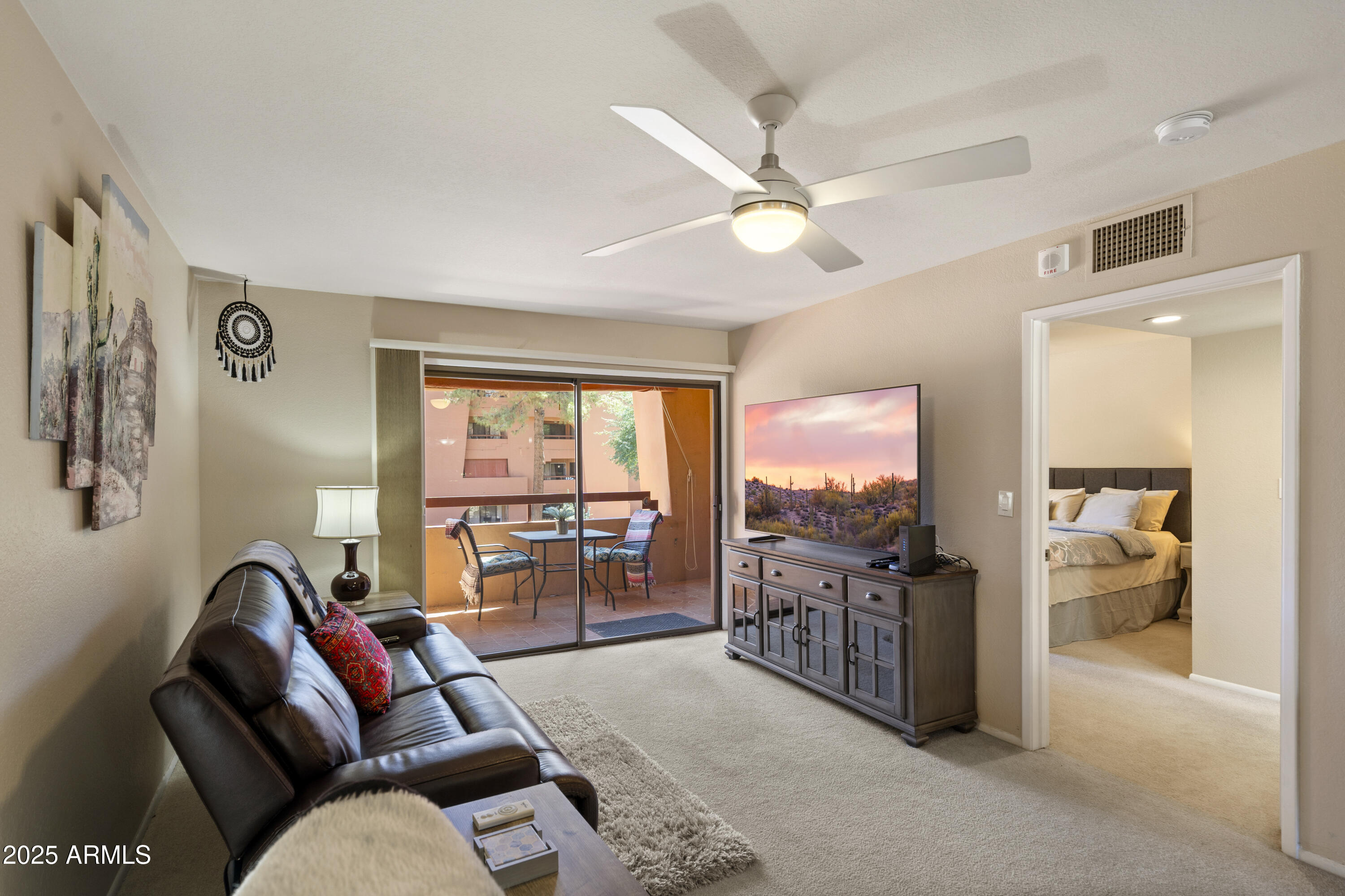 4303 East Cactus Road, Unit 222 Phoenix, AZ 85032 - Photo 7 of 38 Living room and stunning patio view