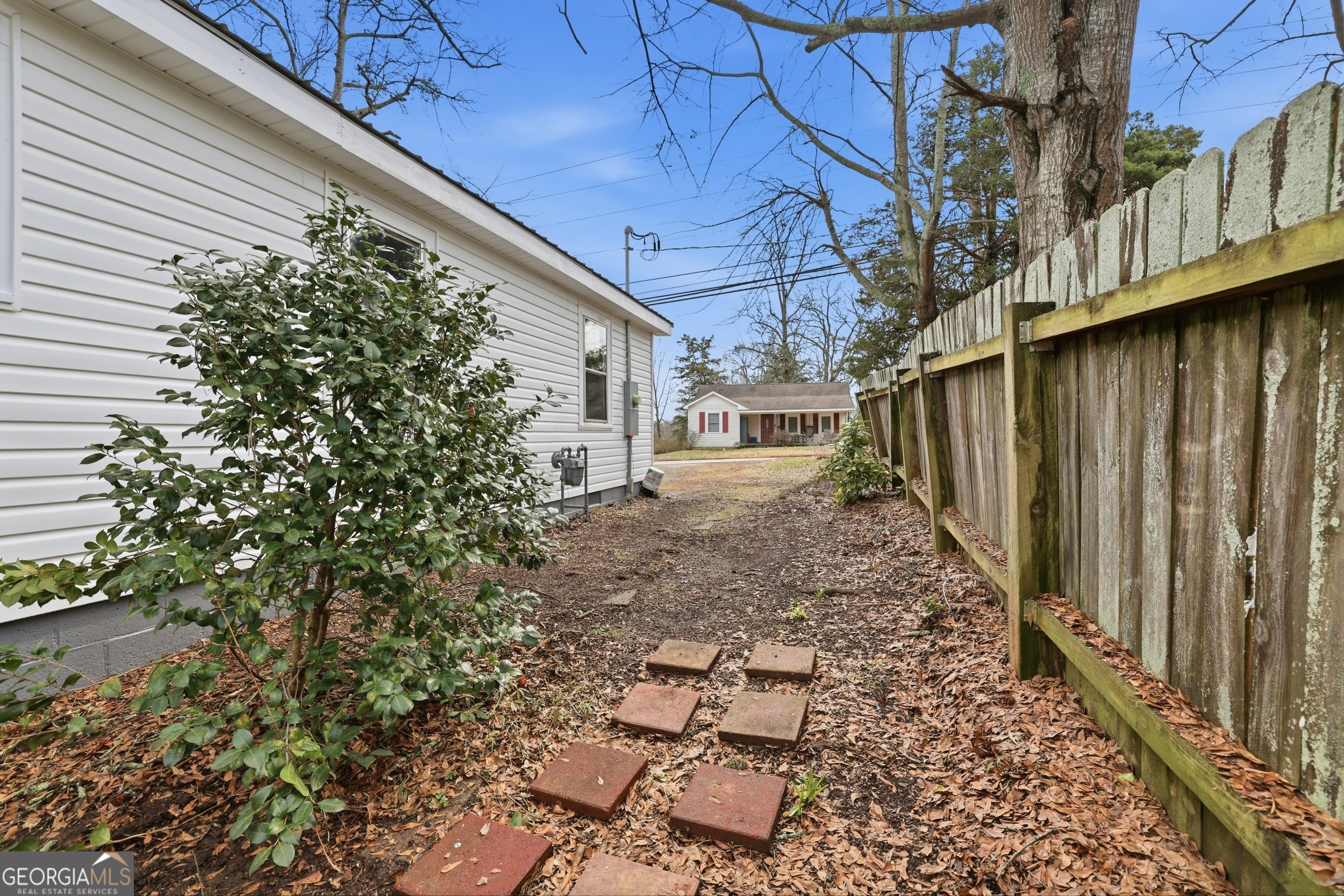 481 Collins Road Toccoa, GA 30577 - Photo 12 of 54 a backyard of a house with table and chairs