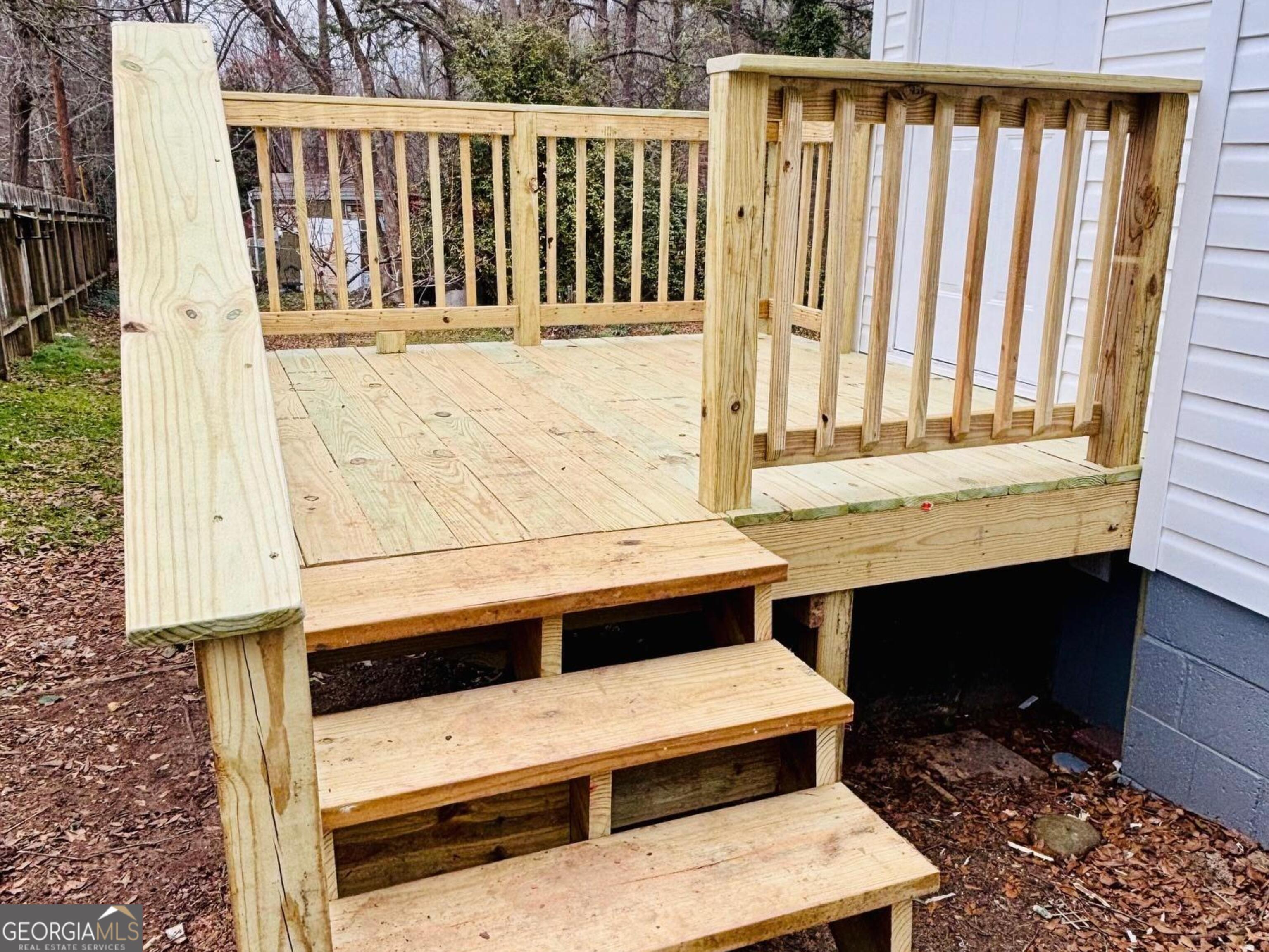 481 Collins Road Toccoa, GA 30577 - Photo 13 of 54 a balcony with table and chairs