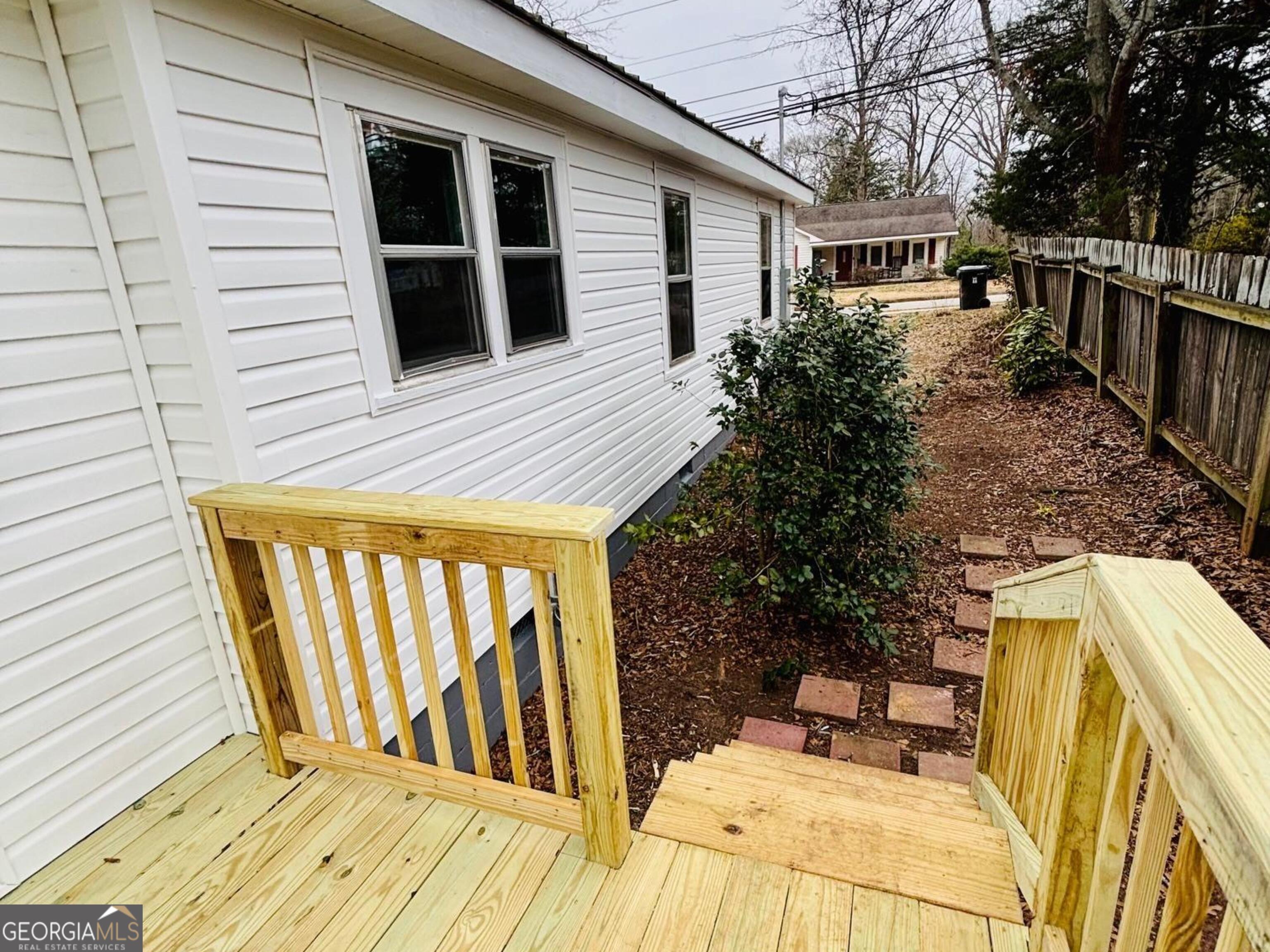 481 Collins Road Toccoa, GA 30577 - Photo 15 of 54 a view of outdoor space with deck and yard