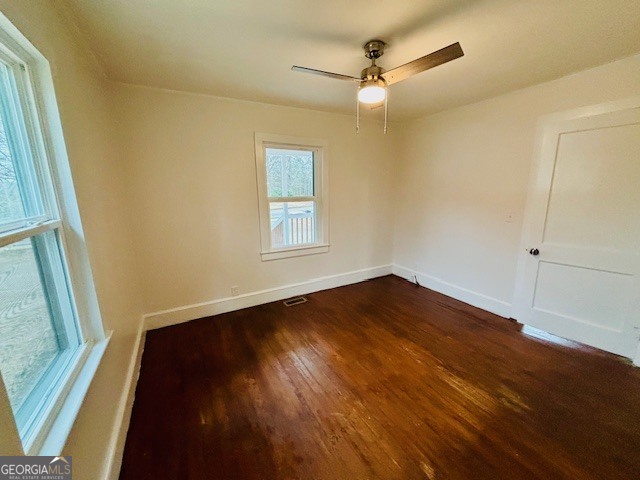 481 Collins Road Toccoa, GA 30577 - Photo 25 of 54 a view of an empty room with wooden floor and a window