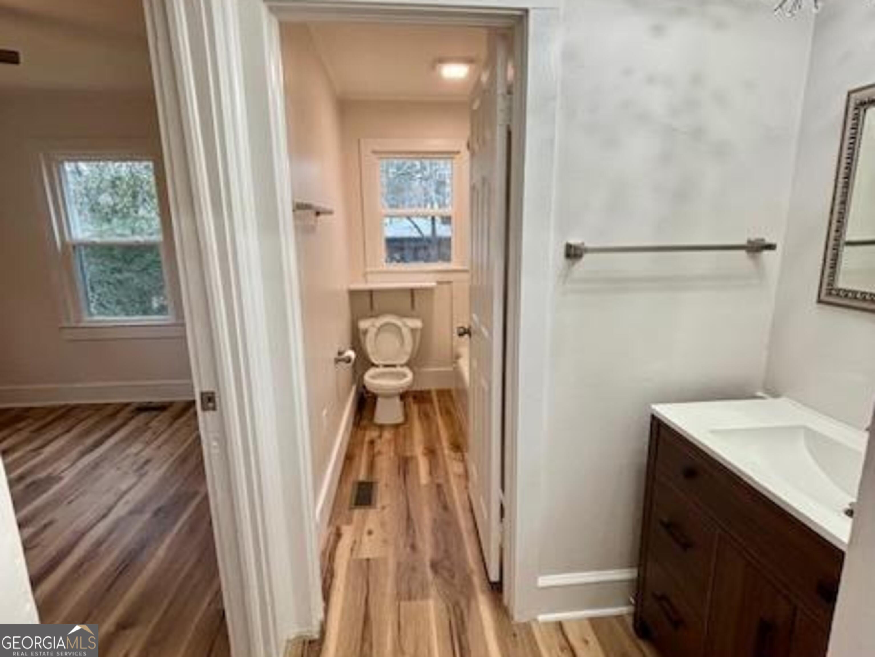 481 Collins Road Toccoa, GA 30577 - Photo 29 of 54 a very nice looking room with wooden floor and a bathroom