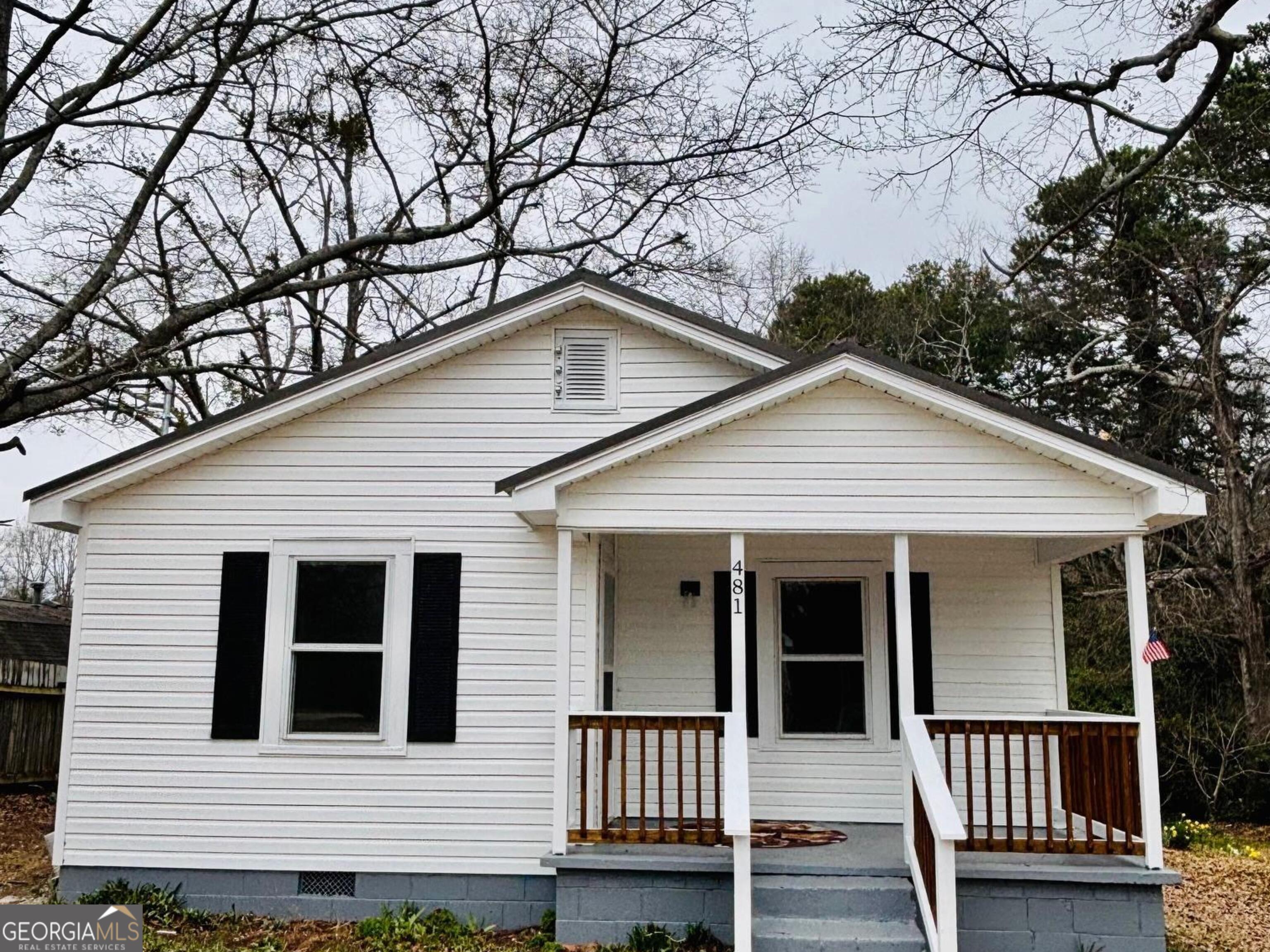 481 Collins Road Toccoa, GA 30577 - Photo 3 of 54 a view of a house with a small yard and wooden fence