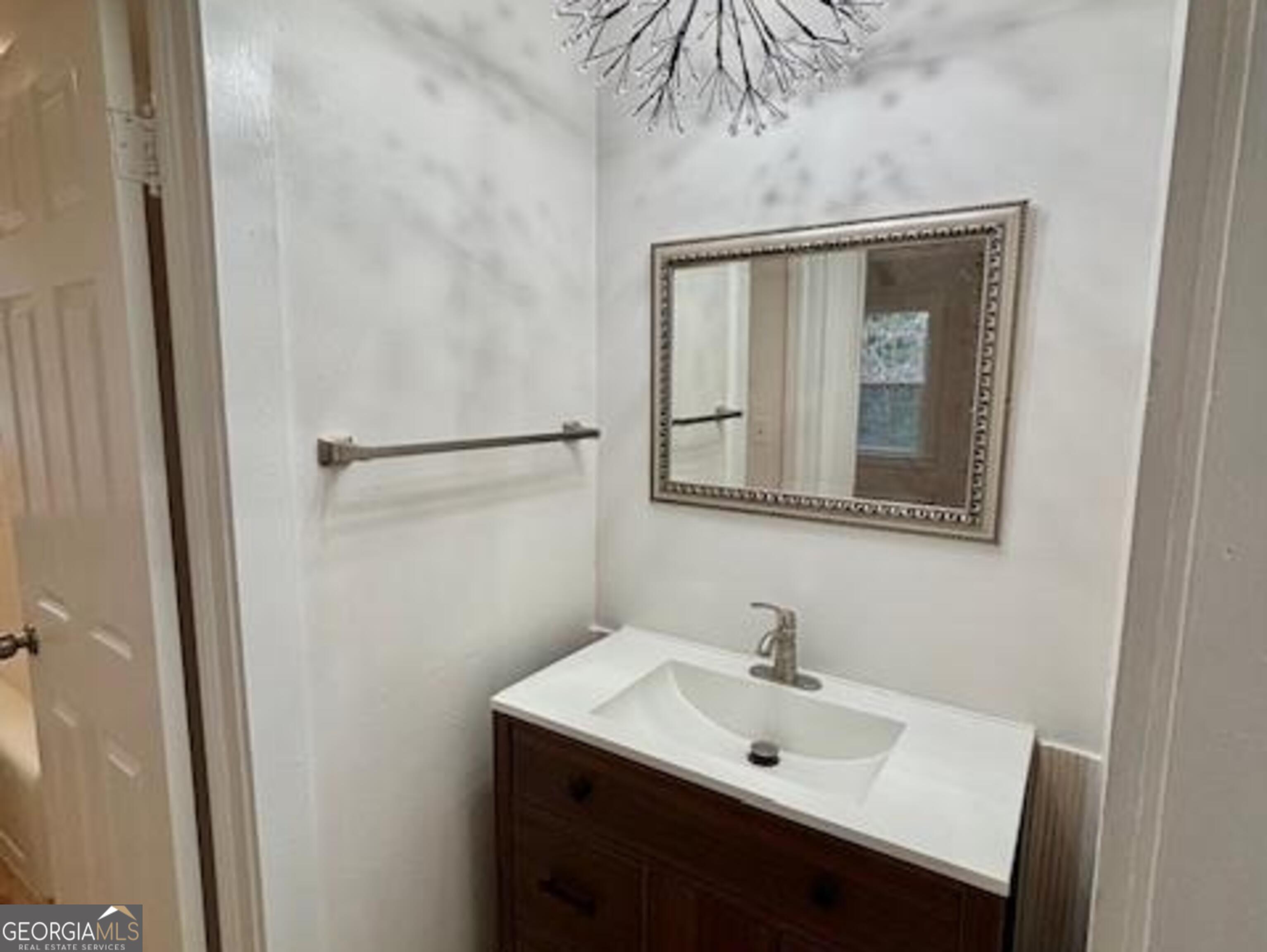 481 Collins Road Toccoa, GA 30577 - Photo 31 of 54 a bathroom with a sink and a mirror