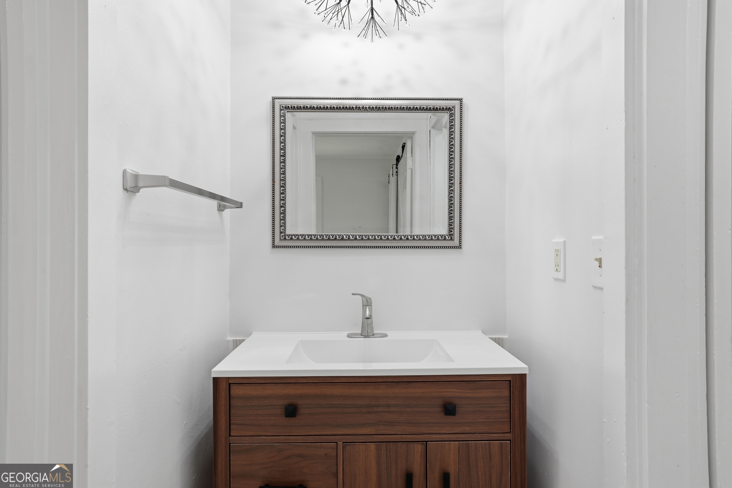 481 Collins Road Toccoa, GA 30577 - Photo 34 of 54 a bathroom with a sink a mirror and vanity
