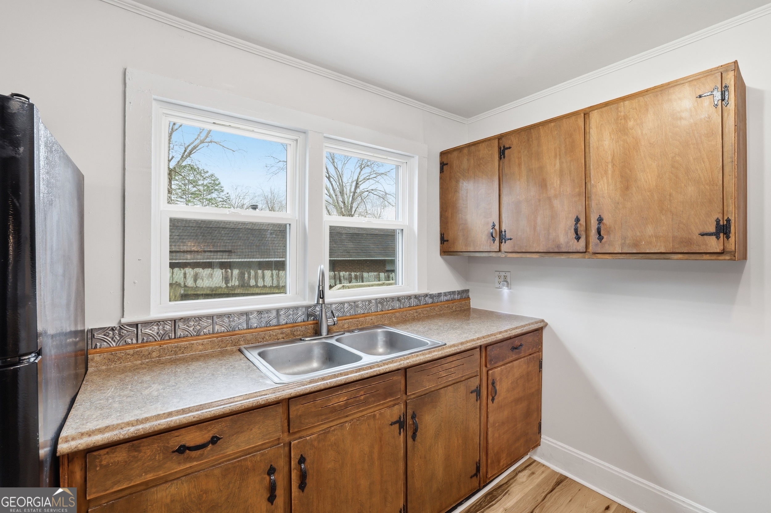 481 Collins Road Toccoa, GA 30577 - Photo 42 of 54 a kitchen with a sink and cabinets