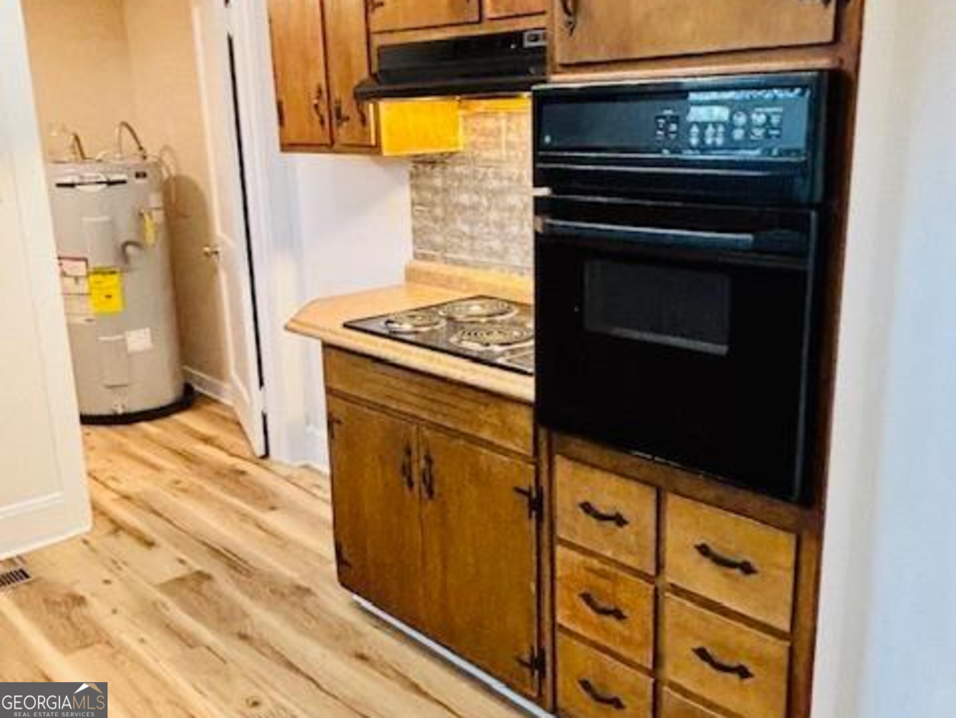 481 Collins Road Toccoa, GA 30577 - Photo 43 of 54 a kitchen with stainless steel appliances granite countertop a stove and a refrigerator