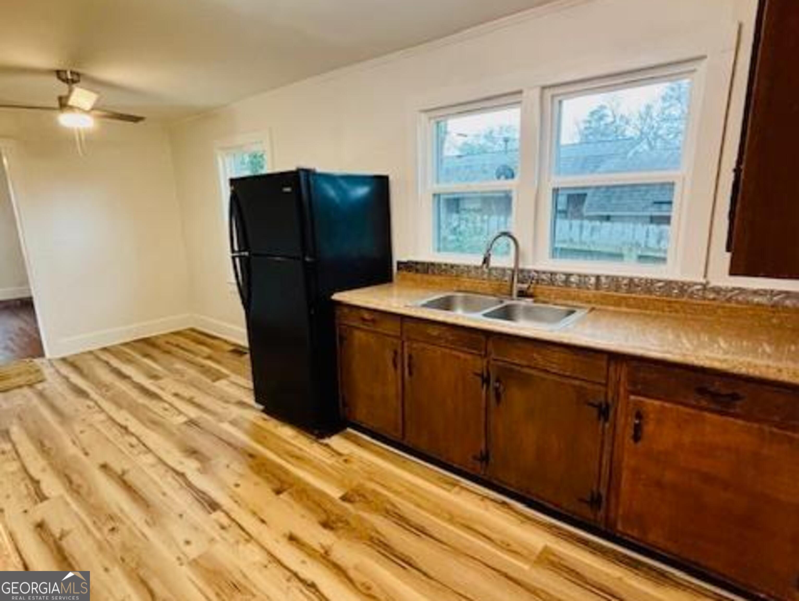 481 Collins Road Toccoa, GA 30577 - Photo 47 of 54 a kitchen with a sink and a refrigerator