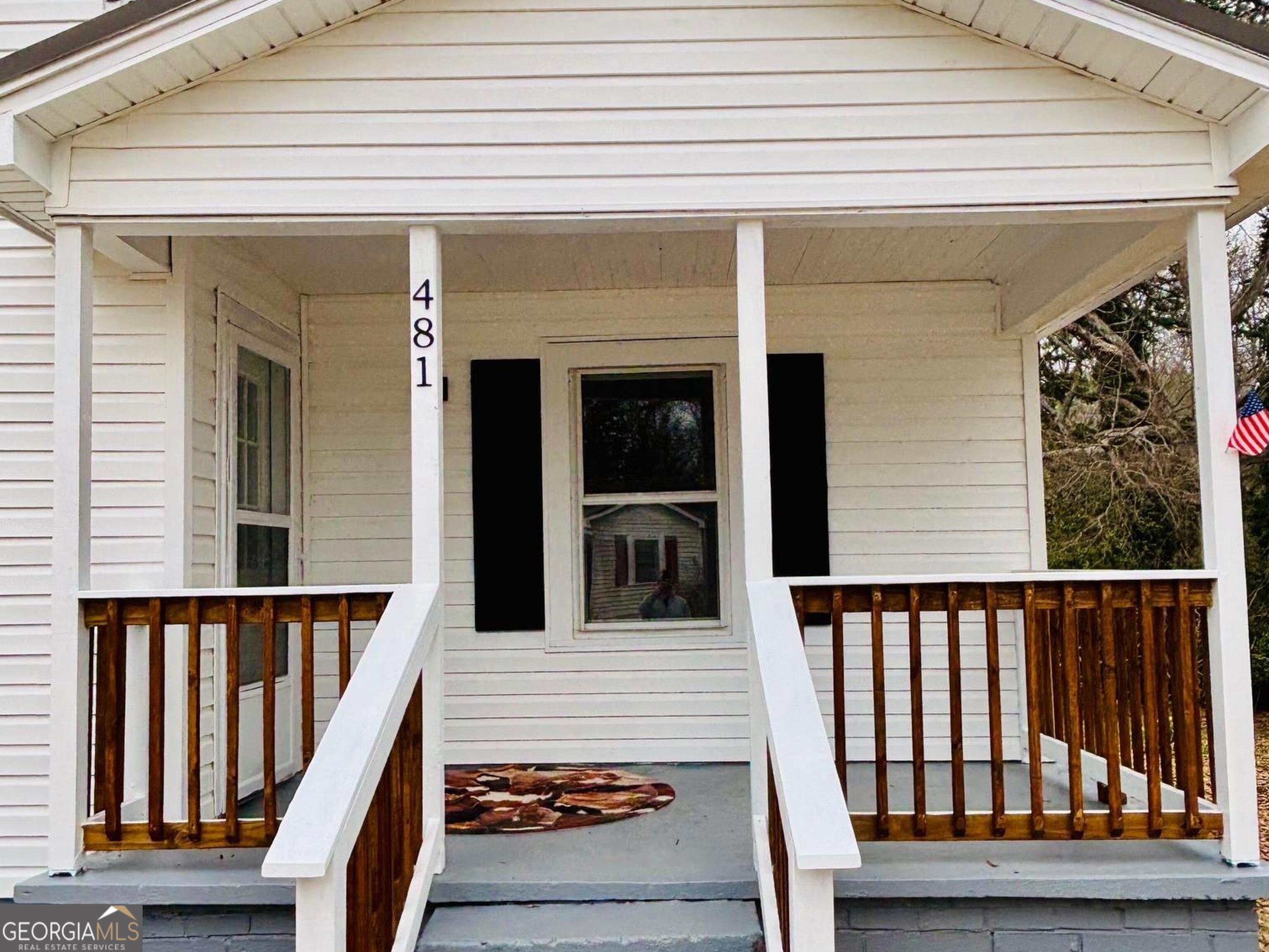 481 Collins Road Toccoa, GA 30577 - Photo 5 of 54 a front view of a house with wooden stairs