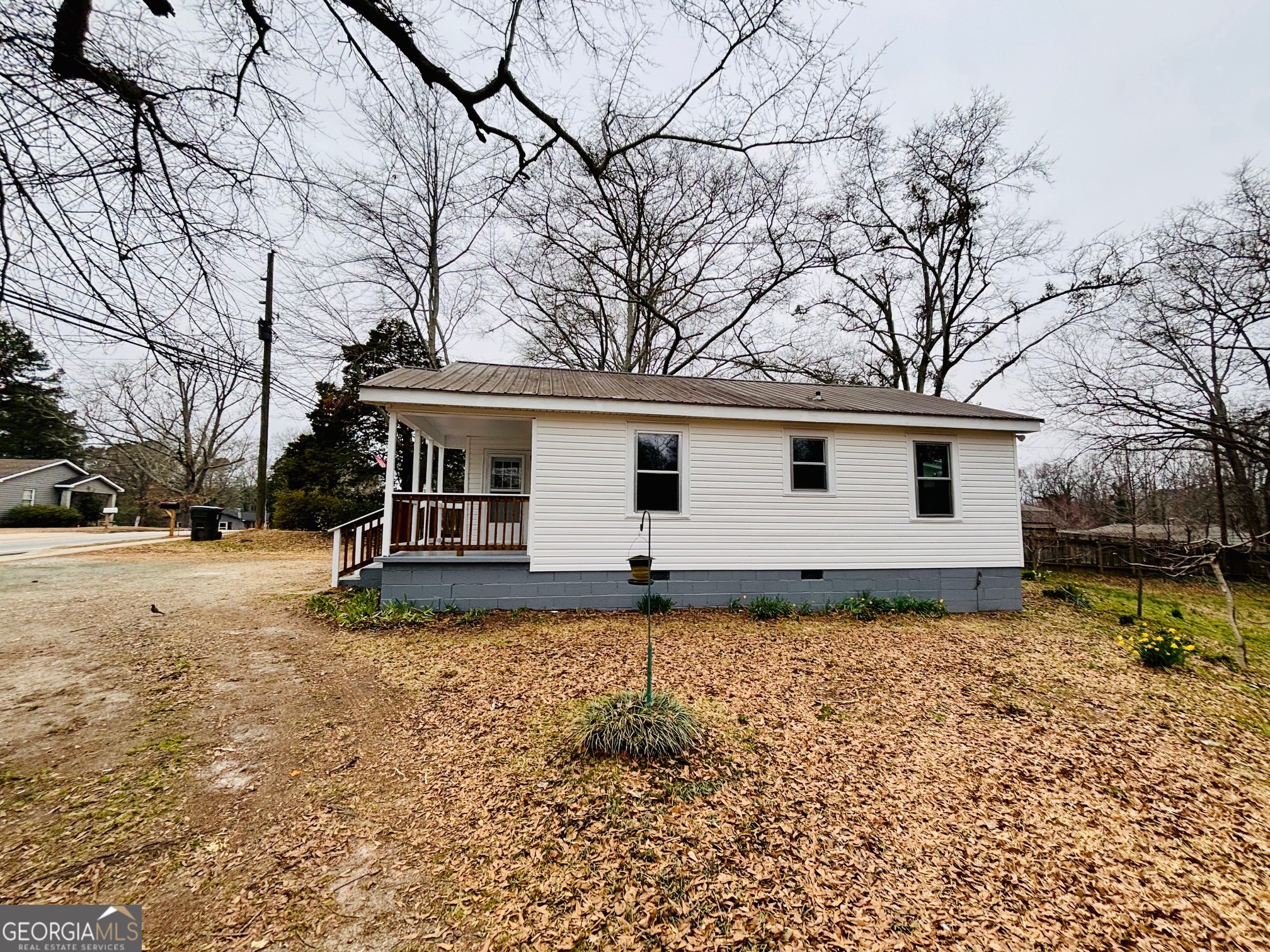 481 Collins Road Toccoa, GA 30577 - Photo 7 of 54 a front view of a house with a yard