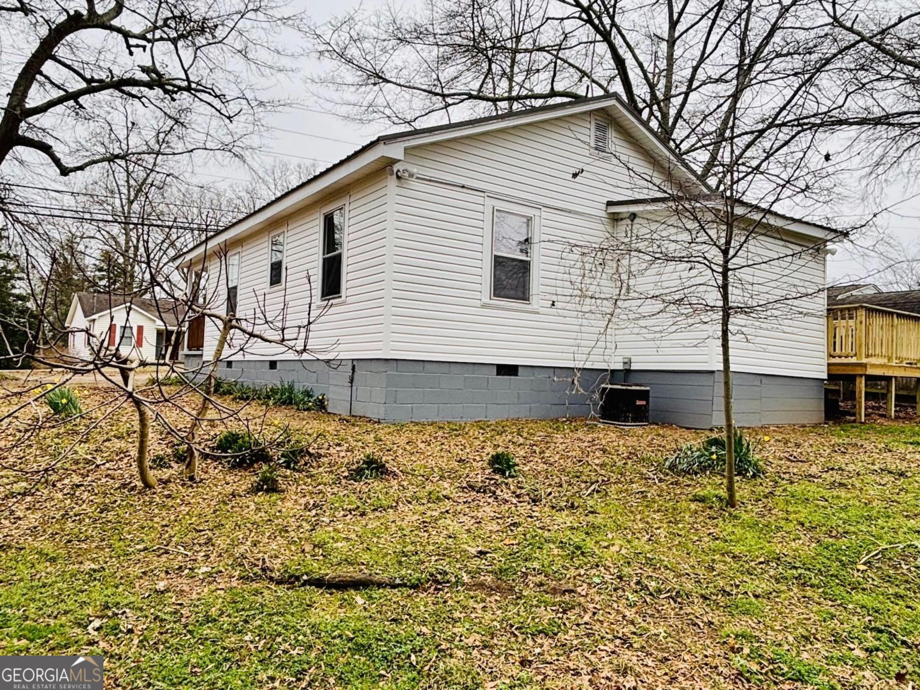 481 Collins Road Toccoa, GA 30577 - Photo 9 of 54 a view of a house with a yard