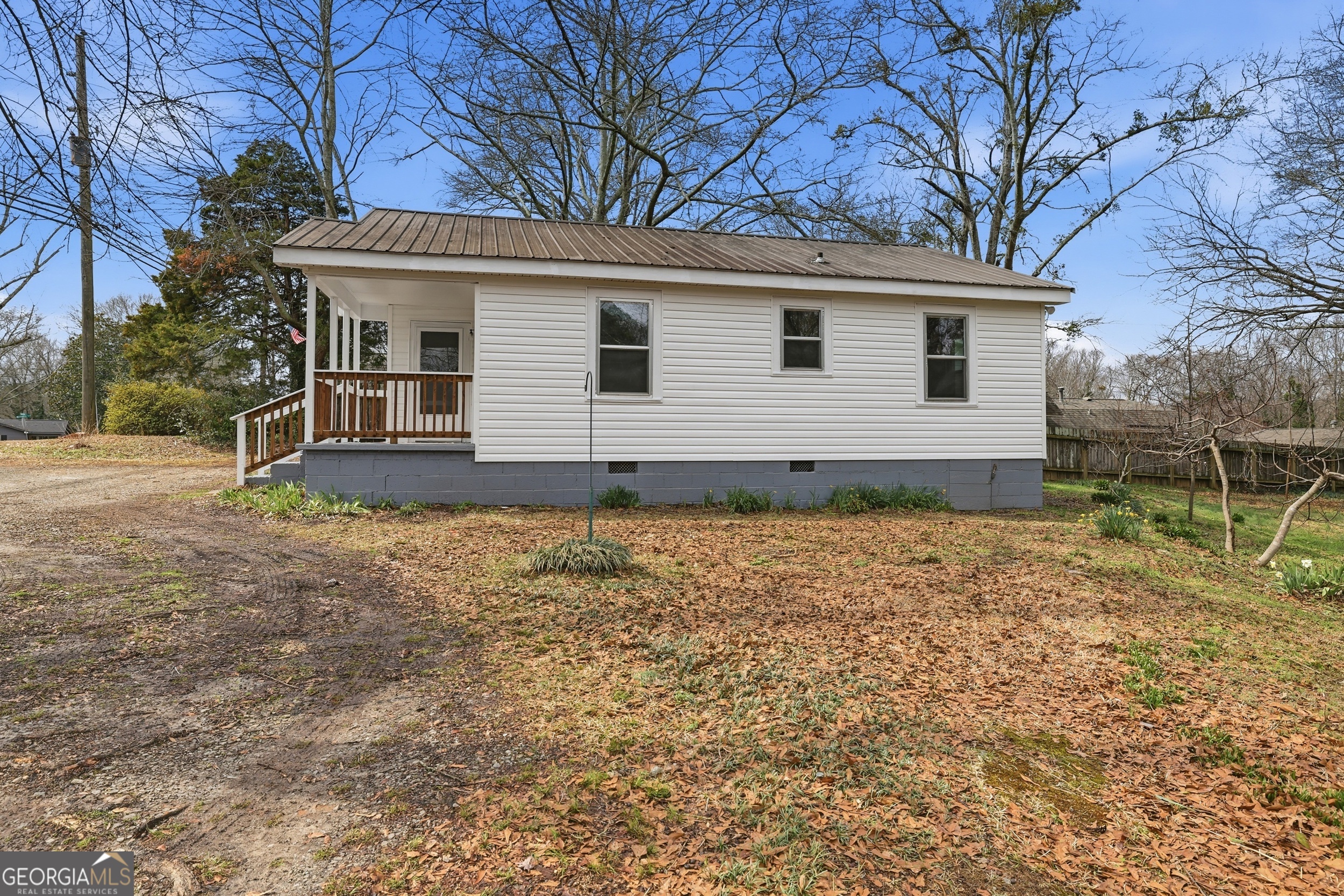 481 Collins Road Toccoa, GA 30577 - Photo 10 of 54 a view of a house with a yard