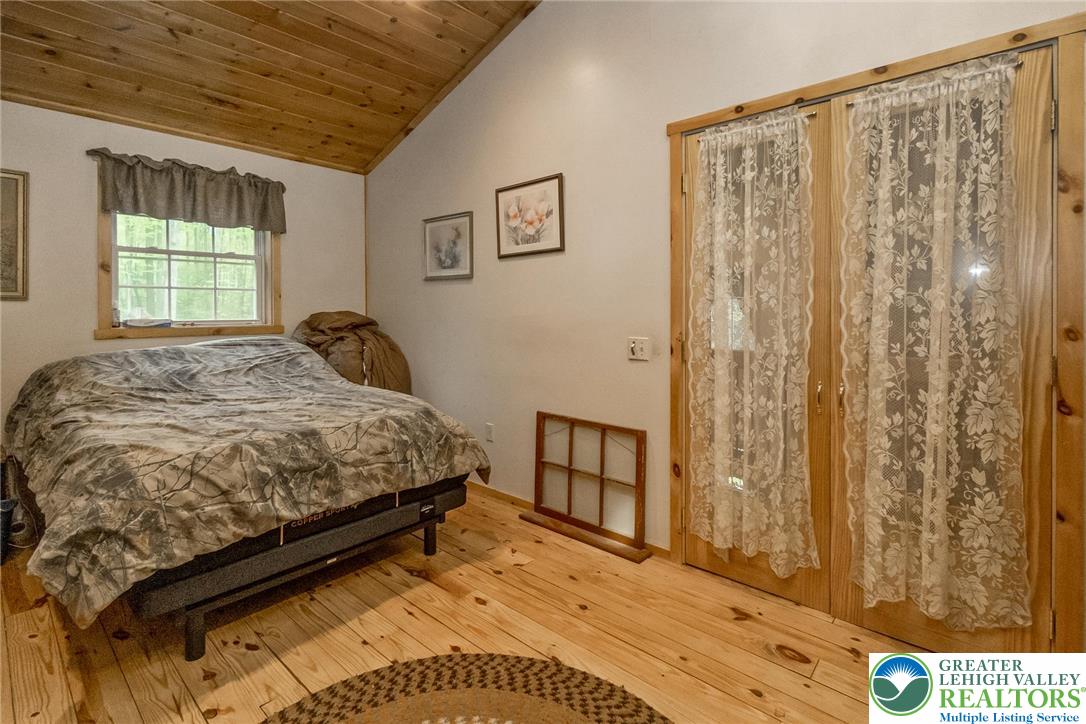 9223 North Loop Road Slatington, PA 18080 - Photo 24 of 60 a bedroom with a bed and a window