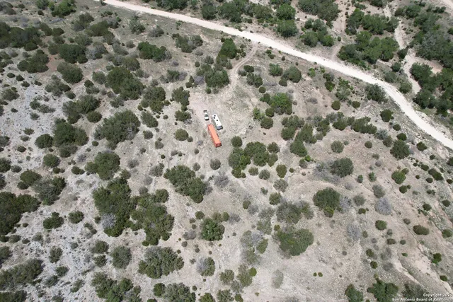 a view of a pathway with a yard