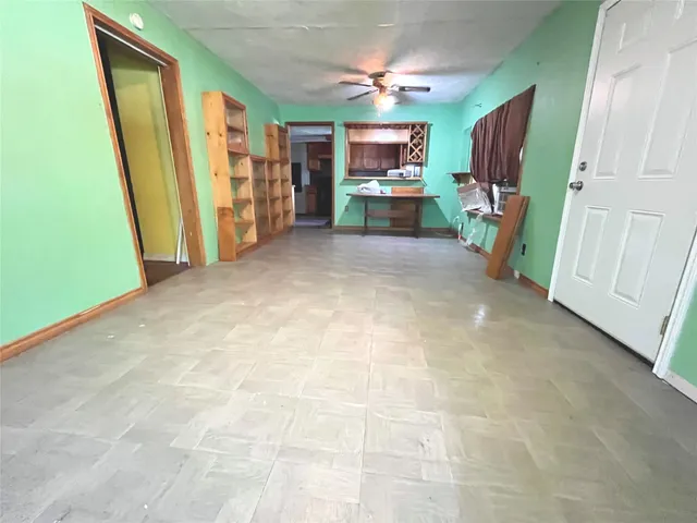 a view of a livingroom with furniture and a flat screen tv