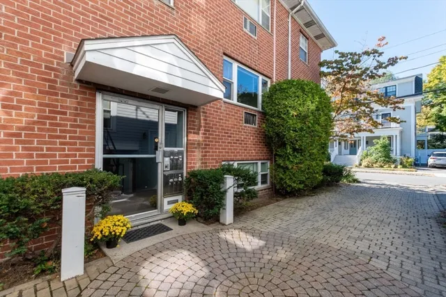 a view of a house with backyard and a patio
