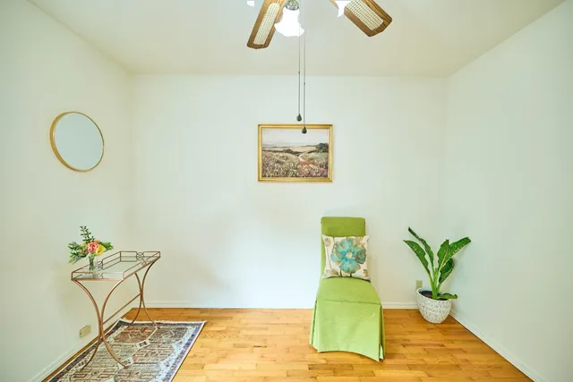 a view of a dining room with a table and chairs