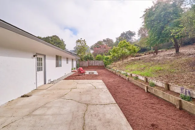 a view of a backyard of the house