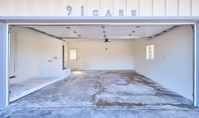 a view of room with window and cabinet