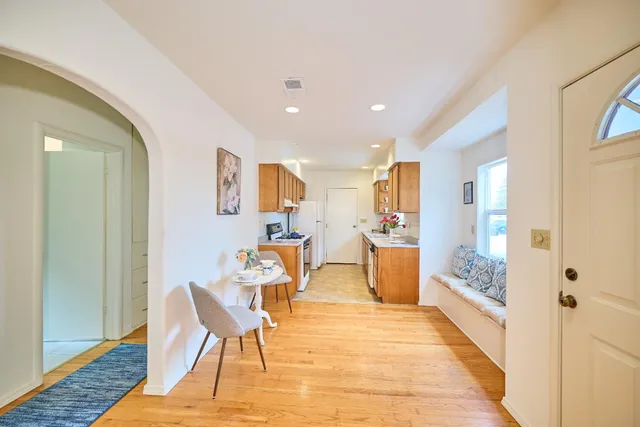 a view of a kitchen and dining room