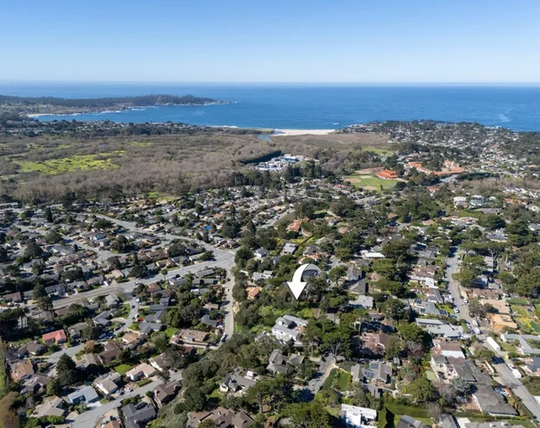 a view of a town with mountains in the background